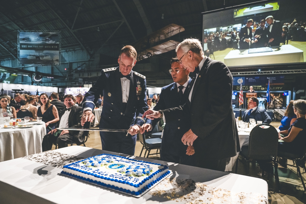 AF Ball (2023) - Lt Gen Morris (AFLCMC/CC), AFA President Dave Babcock, and A1C Ray Scherer (88ABW MDG) Cutting the 76th Anniversary Birthday Cake